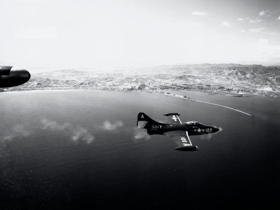 A Grumman F9F Panther fighter jet fires its guns during an attack on the North Korean port of Hungnam.