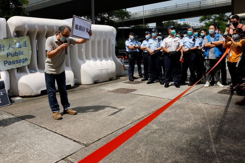 Family members of Hong Kong people arrested by China protest outside China's Liaison Office in Hong Kong