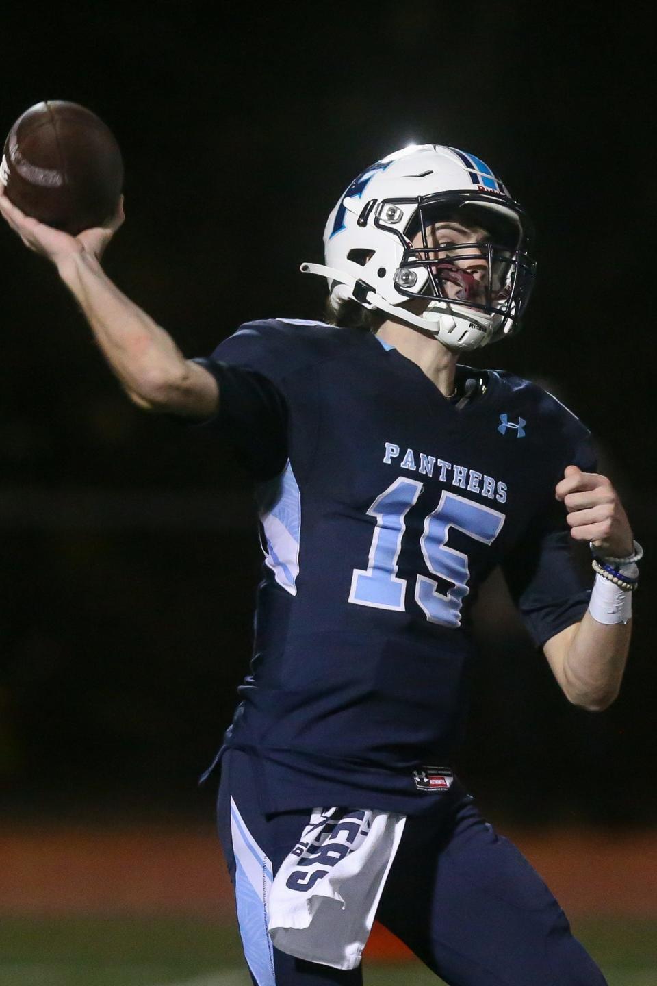 Franklin senior quarterback Jared Arone passes the ball during the Division 1 statewide quarterfinals against Methuen at Franklin High School on Nov. 12, 2021.