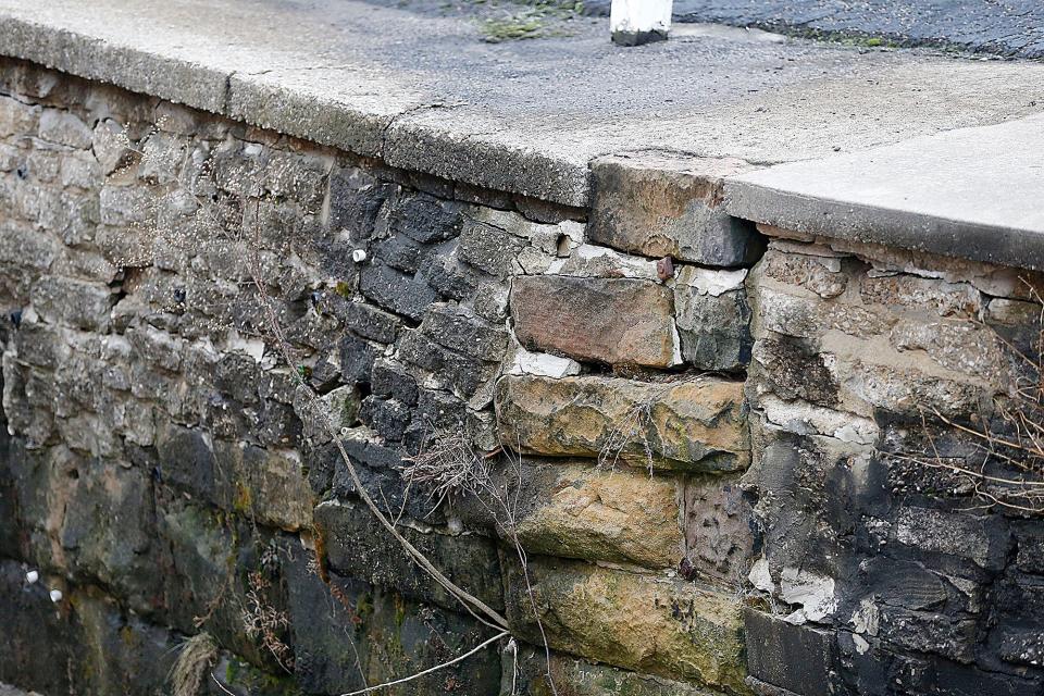 A crumbling retaining wall will need to be fixed at the parking lot's bank at Center Run Creek.