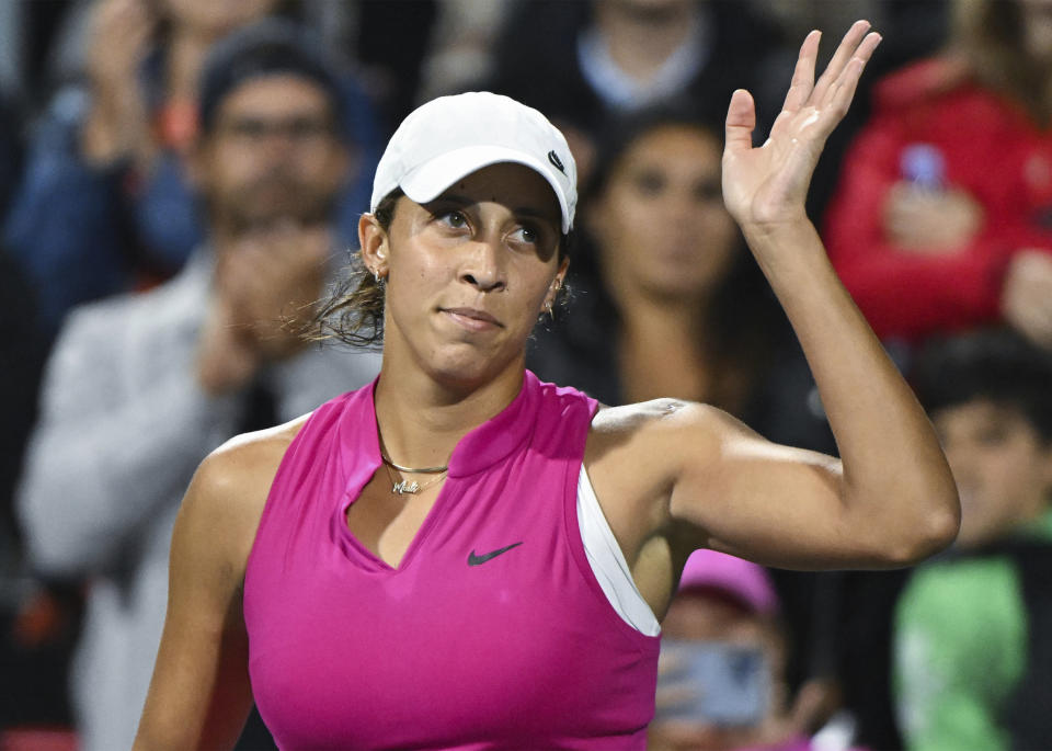 Madison Keys, from the United States, waves to the crowd after defeating Venus Williams during their women's first-round match at the National Bank Open tennis tournament in Montreal, Monday, Aug. 7, 2023. (Graham Hughes/The Canadian Press via AP)