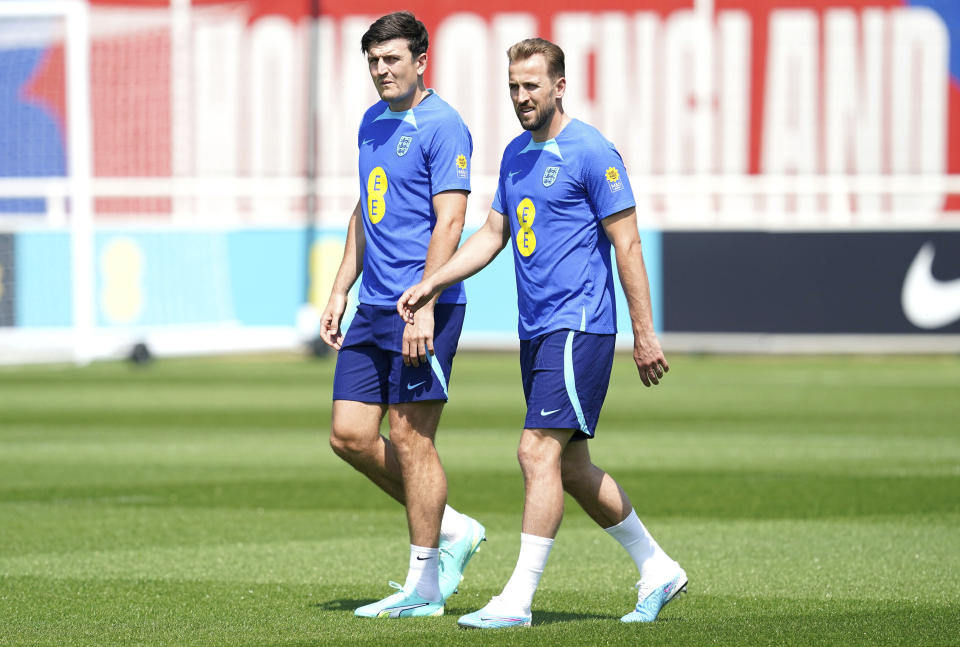 England's Harry Maguire, left, and Harry Kane during a training session ahead of the Euro 2024 matches against Malta and North Macedonia, at St. George's Park, Burton-On-Trent, England, Tuesday June 13, 2023. (Nick Potts/PA via AP)