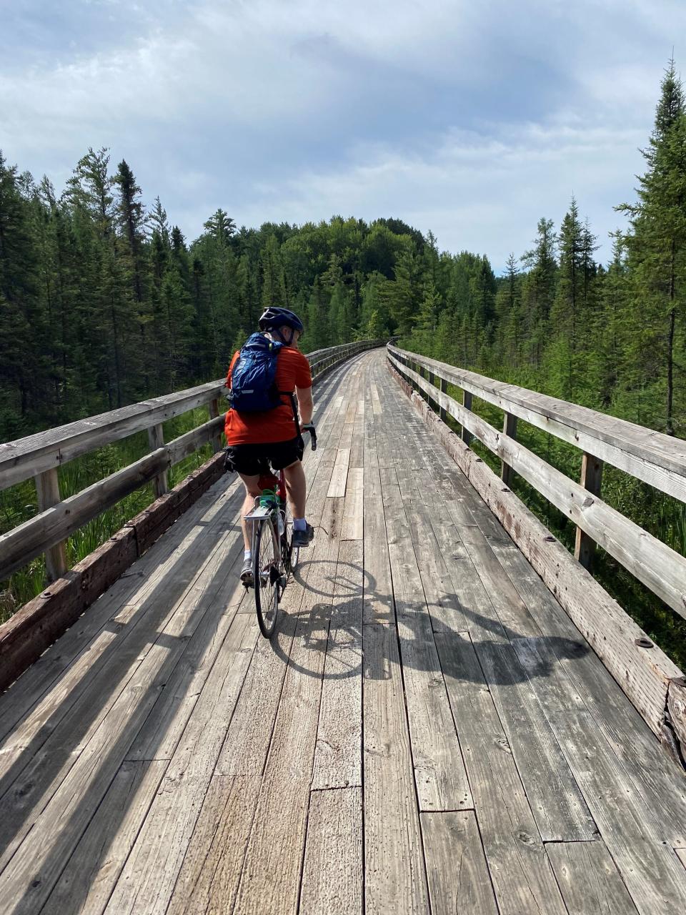 David Paulsen rides on a boardwalk portion of the Bearskin State Trail between Harshaw and Minocqua.