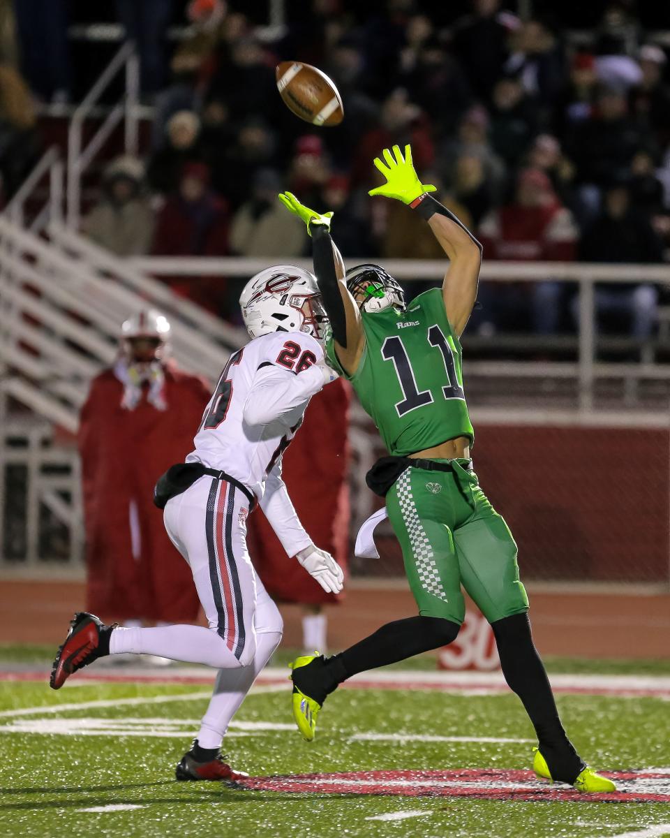 Tippecanoe's Maddox Sivon (26) defends Badin's Braedyn Moore (11) as he pulls down a long pass for a big gain in the first half of play at Trotwood Madison High School on Nov. 18, 2022.