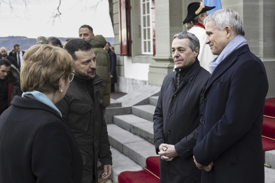 From left, Viola Amherd, Swiss Federal President, Volodymyr Zelenskyy, President of Ukraine, Ignazio Cassis, Swiss Federal Councillors and Swiss Foreign Minister and Beat Jans, Swiss Minister of Justice, talk during a meeting in Kehrsatz near Bern, Switzerland, Monday, Jan. 15, 2024. Zelenskyy will attend the World Economic Forum in Davos starting Tuesday. (Alessandro della Valle/Keystone via AP, Pool)