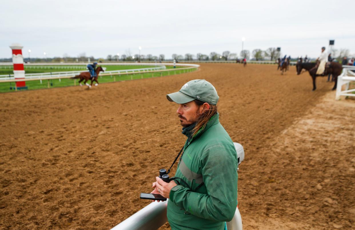 Dr. Nick Smith watches the horses during warm-ups on Spring Meet opening day at Keeneland. April 7, 2023