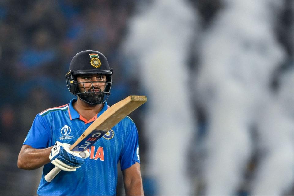 India's captain Rohit Sharma celebrates after scoring a half-century (AFP via Getty Images)