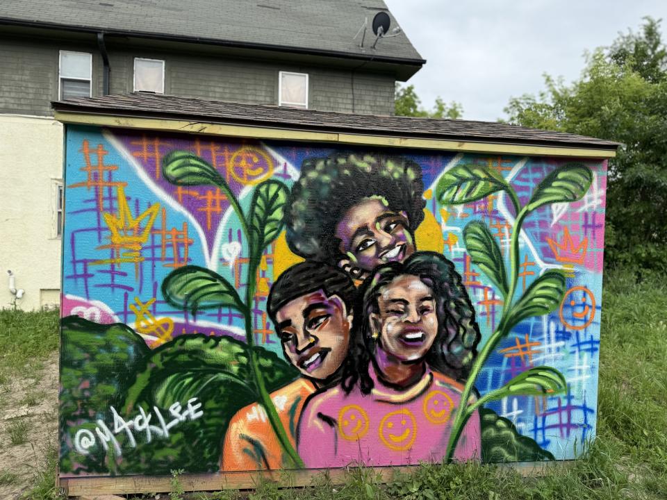 Melody McCurtis of Metcalfe Park Community Bridges worked with a local artist to paint the organization's second shed with imagery around Black joy, liberation and mutual care. It will open in early July.