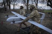 FILE - Ukrainian soldiers with the 22nd Mechanized Brigade prepare to launch the Poseidon H10 Middle-range drone near the city of Bakhmut in Ukraine’s Donetsk region on March 26, 2024. (AP Photo/Efrem Lukatsky, File)