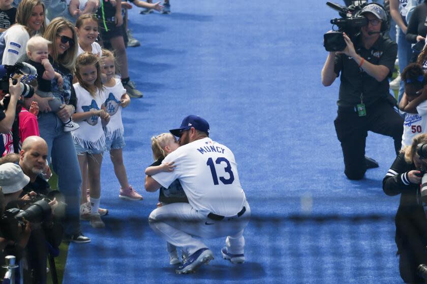 LOS ANGELES, CA - MARCH 28: nLos Angeles Dodgers third baseman Max Muncy (13) is introduced before the game against the St. Louis Cardinals in Dodgers Stadium on Thursday, March 28, 2024 in Los Angeles, CA. (Robert Gauthier / Los Angeles Times)