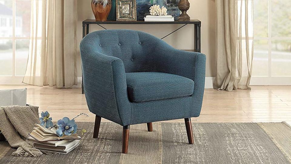 <div class="inline-image__caption"><p><a href="https://amzn.to/349TJas" rel="nofollow noopener" target="_blank" data-ylk="slk:Homelegance Fabric Barrel Chair;elm:context_link;itc:0;sec:content-canvas" class="link ">Homelegance Fabric Barrel Chair</a>, $177</p></div>