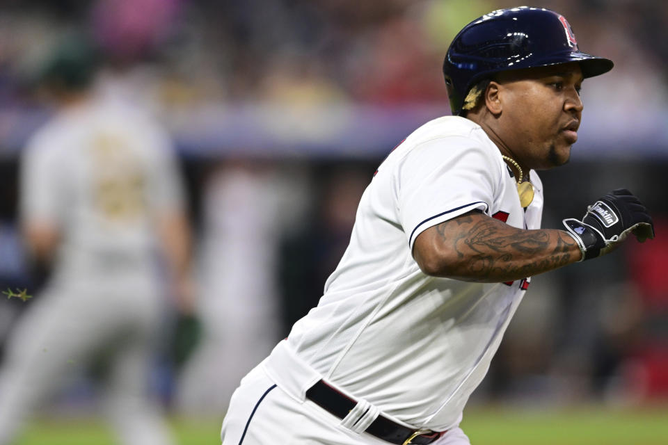 Cleveland Guardians' Jose Ramirez runs to first base after hitting an RBI double against the Oakland Athletics during the seventh inning of a baseball game Tuesday, June 20, 2023, in Cleveland. (AP Photo/David Dermer)