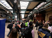 <p>Onlookers view a New Jersey Transit train that derailed and crashed through the station in Hoboken, N.J., on Sept. 29, 2016. (Courtesy of David Richman via REUTERS) </p>