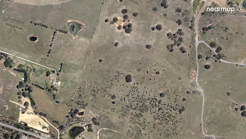 Perhaps the most dramatic visual change in the images is to Spring Farm. A picture of it from 2009 shows mainly farmland. Photo: Nearmap.com.au