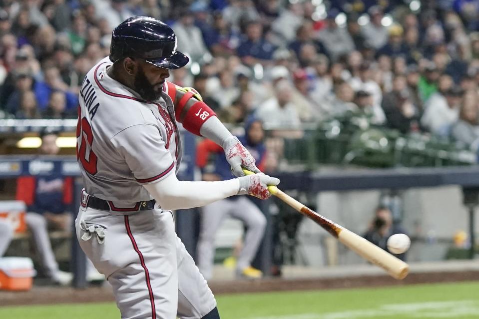 Atlanta Braves' Marcell Ozuna hits a two-run home run during the eighth inning of a baseball game against the Milwaukee Brewers Tuesday, May 17, 2022, in Milwaukee. (AP Photo/Morry Gash)