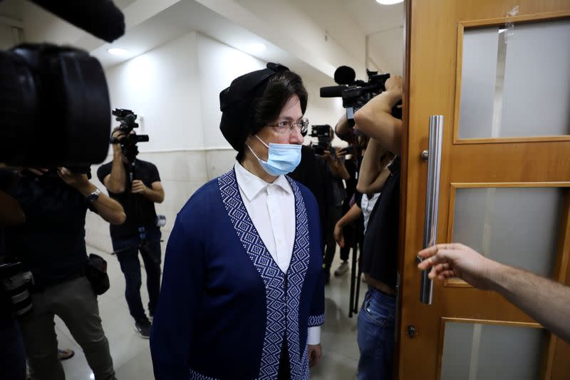 An ultra-Orthodox Jewish woman enters the courtroom ahead of a verdict hearing in the extradition case of Malka Leifer, a former Australian school principal accused of sexually assaulting students, at Jerusalem's District Court