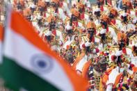 <p>The Indian Border Security Force marching contingent ride camels during India’s Republic Day parade in New Delhi on January 26, 2016. Thousands gathered in New Delhi amid tight security January 26 for India’s annual Republic Day parade, a pomp-filled spectacle of military might featuring camels and daredevil stuntwomen, with French President Francois Hollande the chief guest. </p>