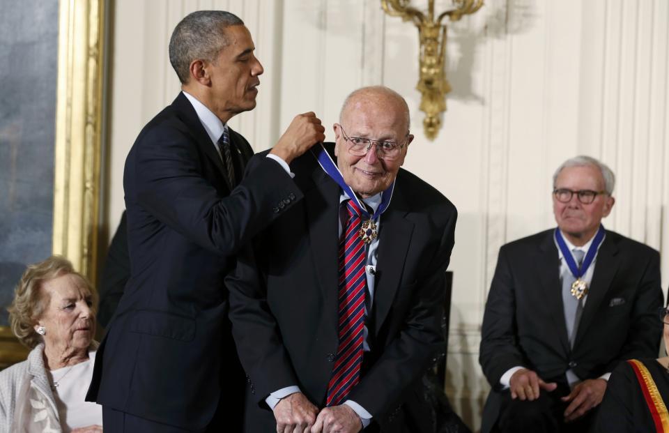 U.S. President Barack Obama awards a Presidential Medal of Freedom to former U.S. Rep. John Dingell, the longest serving Member of Congress in American history, as fellow receipients Ethel Kennedy (L) and Tom Brokaw (R) look on during a ceremony in the East Room of the White House in Washington, November 24, 2014. (REUTERS/Larry Downing)