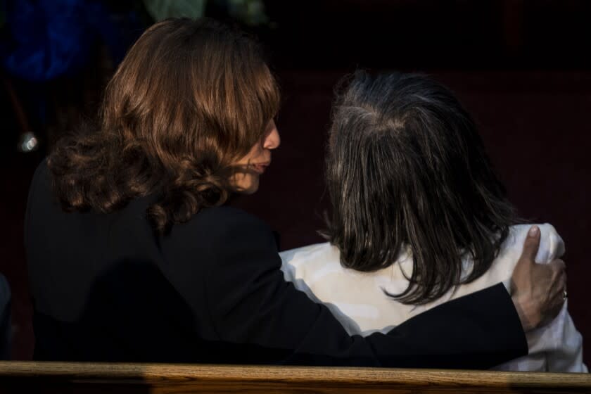 BUFFALO, NY - MAY 28: Vice President Kamala Harris speaks to Robin Harris, the oldest daughter of Ruth Whitfield, as they attend the funeral of Ruth Whitfield at Mt. Olive Baptist Church, on Saturday, May 28, 2022 in Buffalo, NY. Mrs. Whitfield was one of ten people killed two weeks ago in what federal officials are calling an act of "racially motivated violent extremism," by a white man, in the shooting of a supermarket in a historically black neighborhood of Buffalo, NY. (Kent Nishimura / Los Angeles Times)