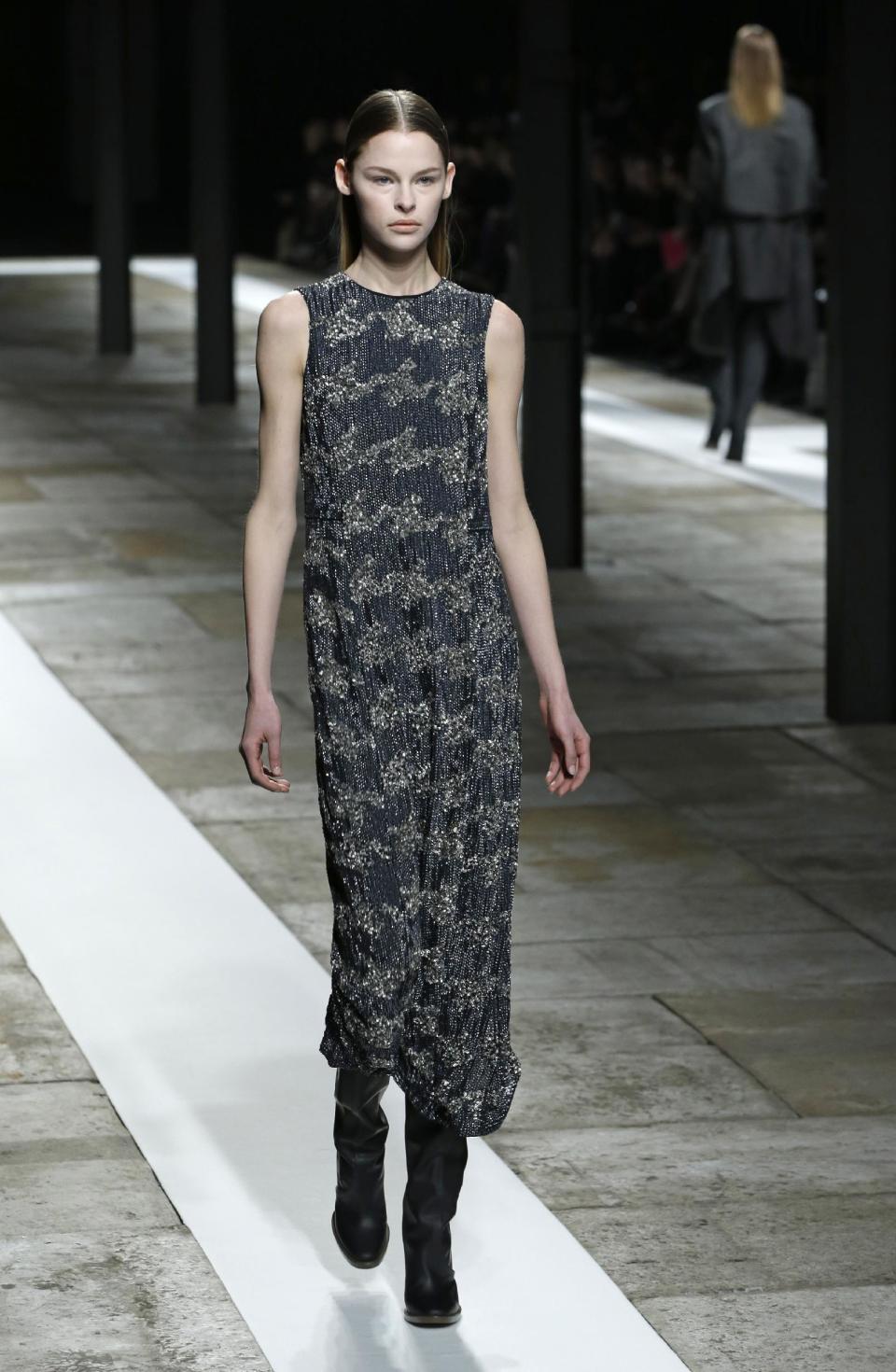 A model walks the runway during the Theyskens Theory Fall 2013 runway show at Fashion Week in New York, Monday, Feb. 11, 2013. (AP Photo/Kathy Willens)