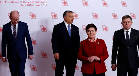 Visegrad Group (V4) member nations' Prime Ministers, Bohuslav Sobotka of the Czech Republic, Hungary's Viktor Orban, Poland's Beata Szydlo and Slovakia's Robert Fico pose for a family photo during a summit in Warsaw, Poland March 2, 2017. REUTERS/Kacper Pempel