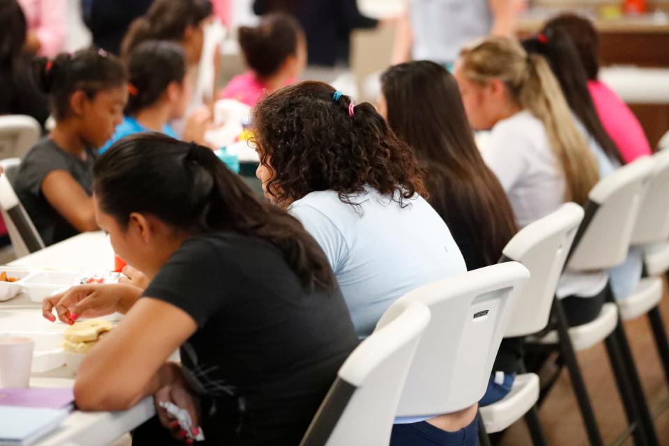 Girls eat lunch at a shelter for migrant teenage girls, in Lake Worth, Florida, on Sept. 24, 2019.