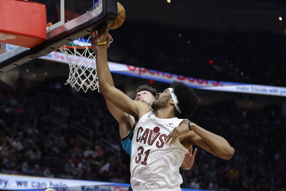 Cleveland Cavaliers center Jarrett Allen (31) shoots against Portland Trail Blazers forward Drew Eubanks (24) during the first half of an NBA basketball game, Wednesday, Nov. 23, 2022, in Cleveland. (AP Photo/Ron Schwane)