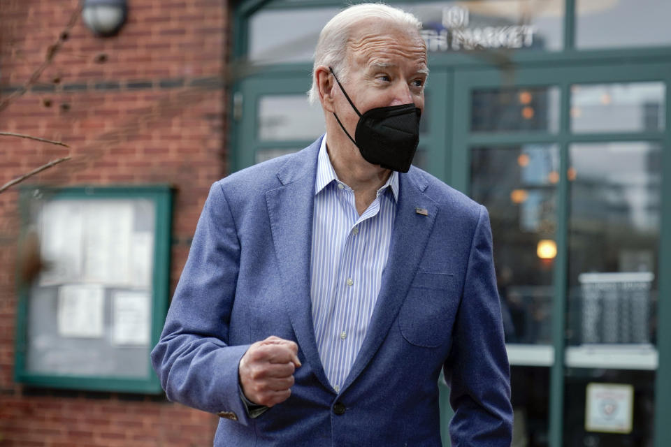 President Joe Biden speaks to members of the media as he leaves Banks' Seafood Kitchen after having New Year's Eve lunch with first lady Jill Biden in Wilmington, Del., Friday, Dec. 31, 2021. (AP Photo/Carolyn Kaster)