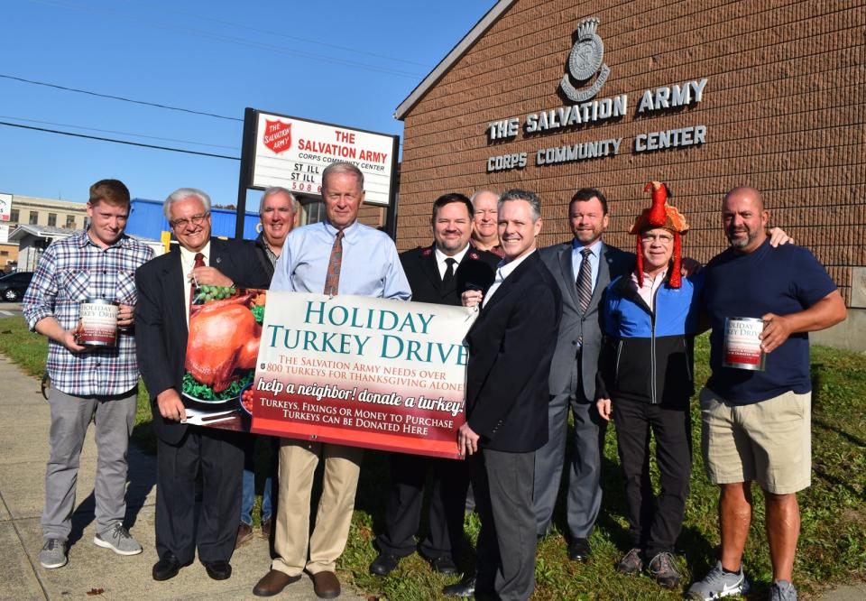 In October, the Salvation Army held a kickoff for its annual Holiday Turkey Drive. Pictured from left are board members Brian Pudlo, Carl Sawejko, James Carey, Mayor Paul Coogan, Salvation Army Major Geoffrey Swires, board member David Teixeira, board chairman Curt Nelson and board members Seth Hockert-Lotz and Carlos Ferreira. The meals will be available for pickup on Nov. 24.