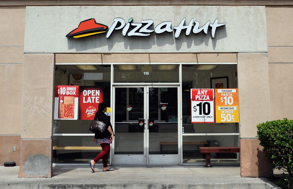 A customer walks in to a Pizza Hut restaurant during lunchtime in Los Angeles.