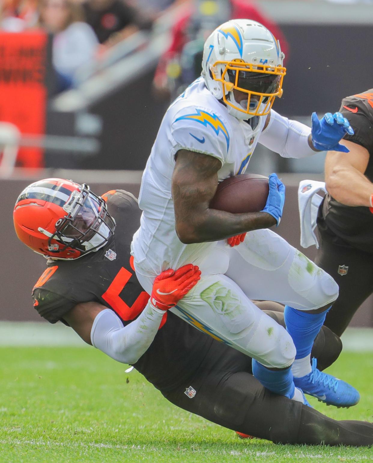 Browns linebacker Jacob Phillips takes down Chargers tight end Gerald Everett on Sunday, Oct. 9, 2022 in Cleveland.