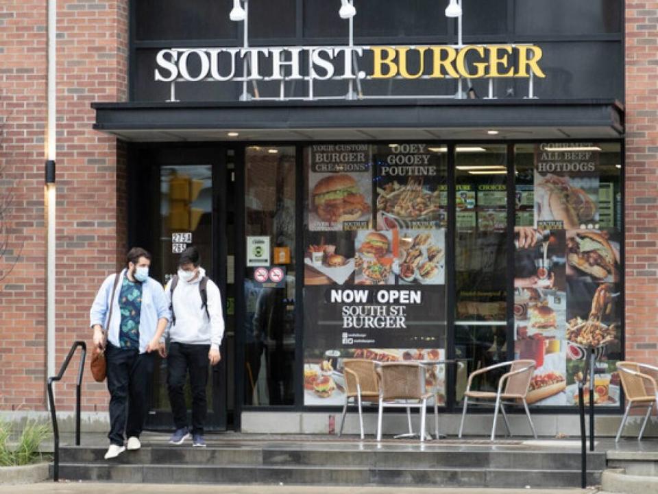 Patrons exit a South St. Burger in Ottawa. On Friday, the Ontario government announced plans to lift all remaining COVID-19 health measures by the end of March 2022. (Jean Delisle/CBC - image credit)