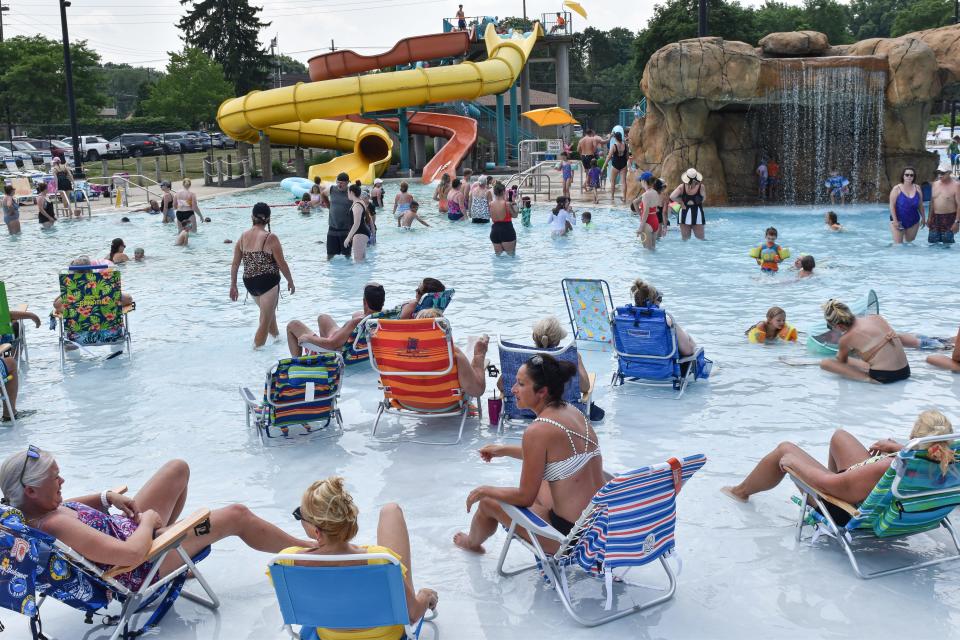 Season pass holders cool off at the Water Works Family Aquatic Center amidst 92 degree heat, Monday, June 17, 2024, in Cuyahoga Falls, Ohio.