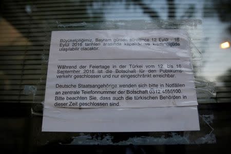 A note at the entrance of the German Embassy is seen in Ankara, Turkey, September 14, 2016. Letters in Turkish reads, "Our Embassy is closed between September 12-September 16 (during the public holiday) and will be limitedly accessible". REUTERS/Tumay Berkin