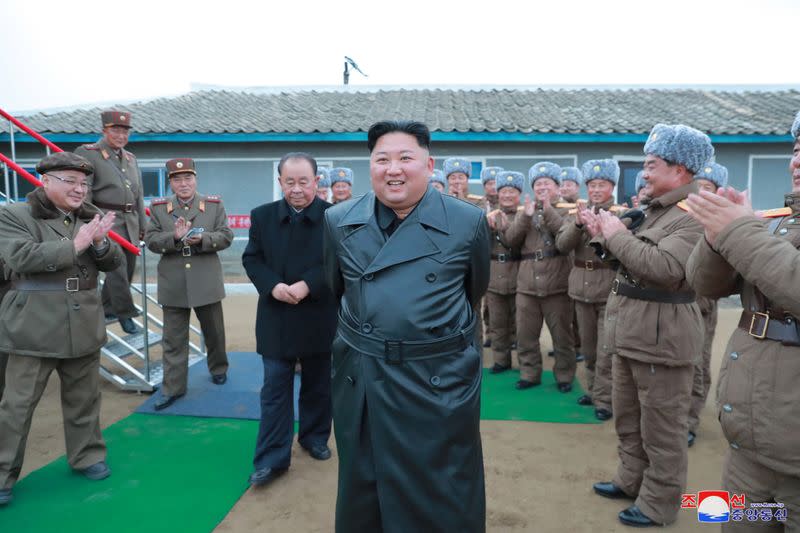 North Korean leader Kim Jong Un oversees rocket system test in this undated picture released by KCNA