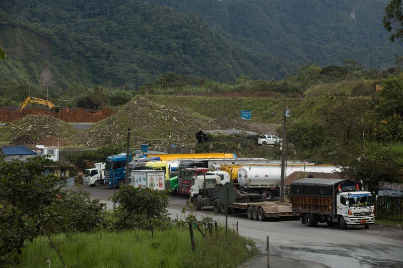 Tankers are parked near a damaged section of oil pipeline, about 25 km from the city of Tena in the Amazon