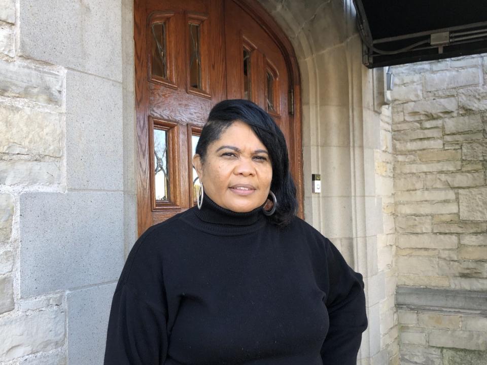 Michelle Pitts, owner of New Pitts Mortuary, stands outside her Milwaukee funeral home.