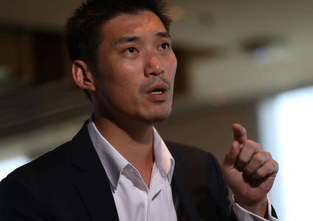 FILE PHOTO: Thanathorn Juangroongruangkit, founder of Thailand's Future Forward Party, speaks during an interview at the Reuters office in Bangkok, Thailand March 19, 2018. Picture taken March 19, 2018. REUTERS/Soe Zeya Tun/File Photo