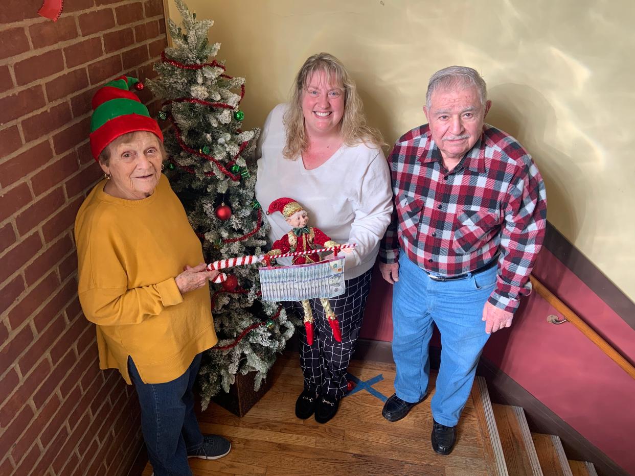 Secret Santa (a.k.a. former Gardner Mayor Charlie Manca) made his annual visit to the Gardner CAC on Tuesday, Dec. 12. From left, CAC volunteer Terri Hillman, Executive Director Julie Meehan, and Charlie Manca.