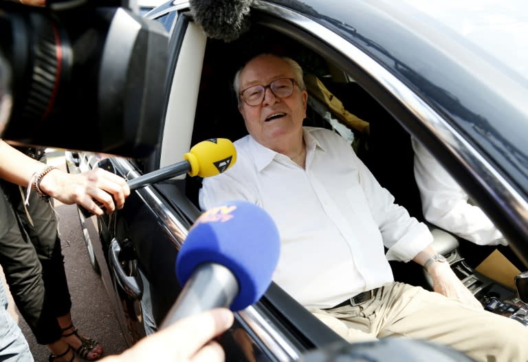 Jean-Marie Le Pen speaks to journalists as he arrives at the National Front party headquarters in Nanterre on July 3, 2015, a day after the cancellation by the court of his suspension from the party