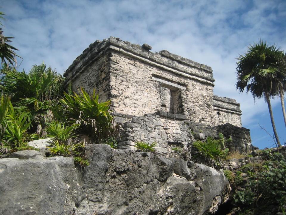 This December 2011 photo shows a pyramid at the Mayan ruins in Tulum, Mexico. Early morning visitors to the ancient archaeological sites on Mexico’s Riviera Maya can avoid the crowds that often gather later in the day. (AP Photo/Kim Curtis)