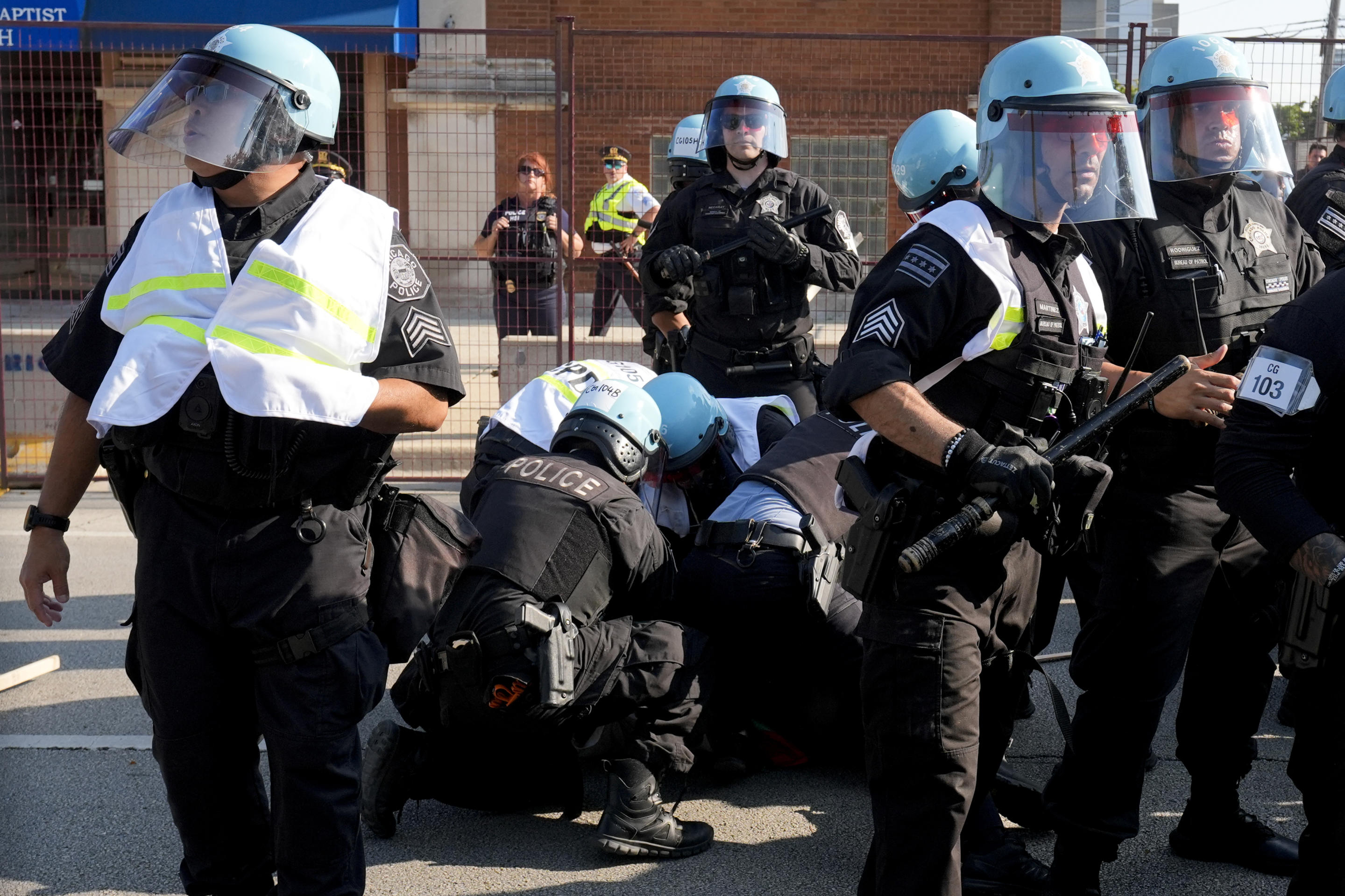 Police arrest a protester outside the Democratic National Convention in Chicago on Monday. (Frank Franklin II/AP)