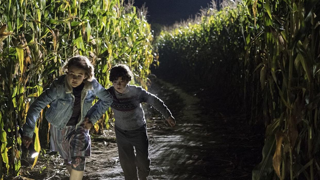 two kids run through a cornfield in a scene from a quiet place a good housekeeping pick for best halloween movies