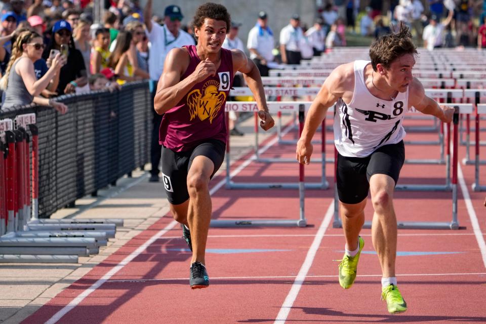 Westerville North’s William Baumann, left, and Massillon Perry’s Garrett Laubacher run the 110 hurdles in the Division I state meet last year.