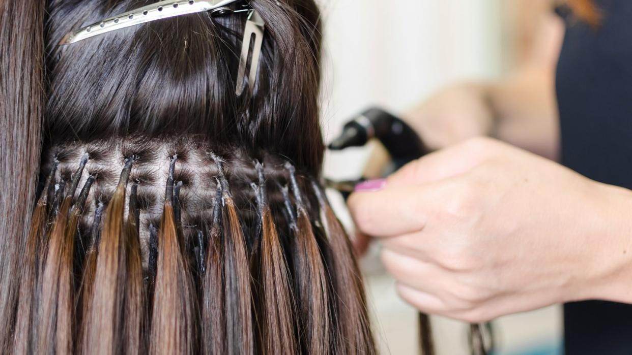 female hand upgrading hair in the salon