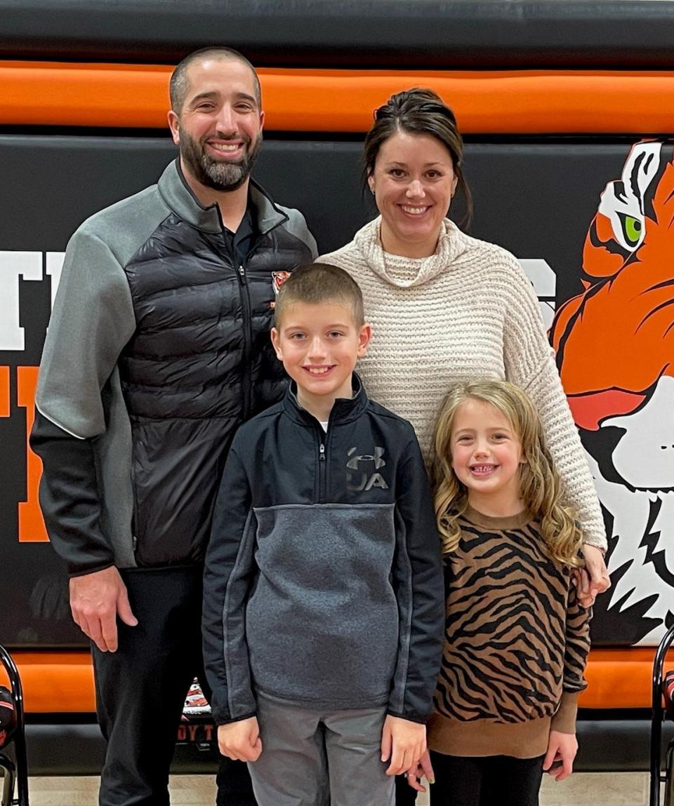 Brett Hershberger and his family celebrate after his induction.