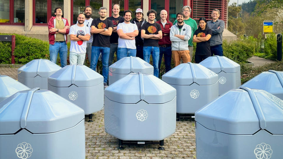 Sunflowers Labs staff outside office with a lot of drone beehives