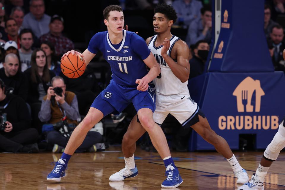 Creighton center Ryan Kalkbrenner (11) dribbles against Villanova forward Jermaine Samuels (23) during the Big East tournament final.