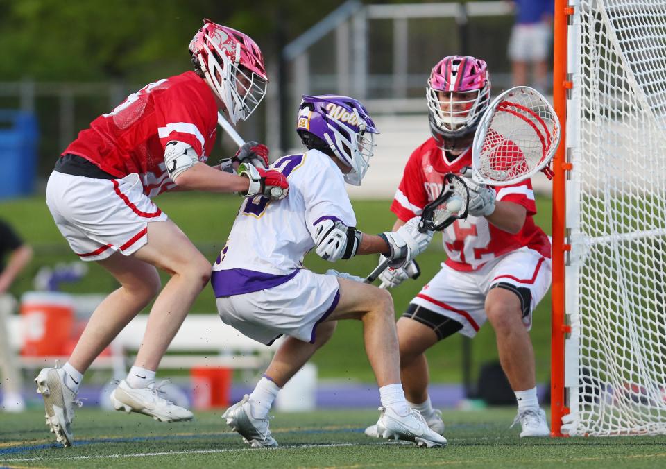 John Jay's Luca Diva (2) drives to the goal in front of Somers goalie Landon Pepe (22) during lacrosse action at John Jay High School in Cross River May 7, 2024. John Jay won the game 11-10.