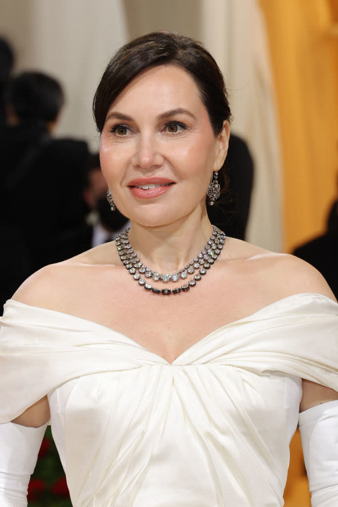 Close-up of Fabiola's neckline and bejeweled necklace and earrings